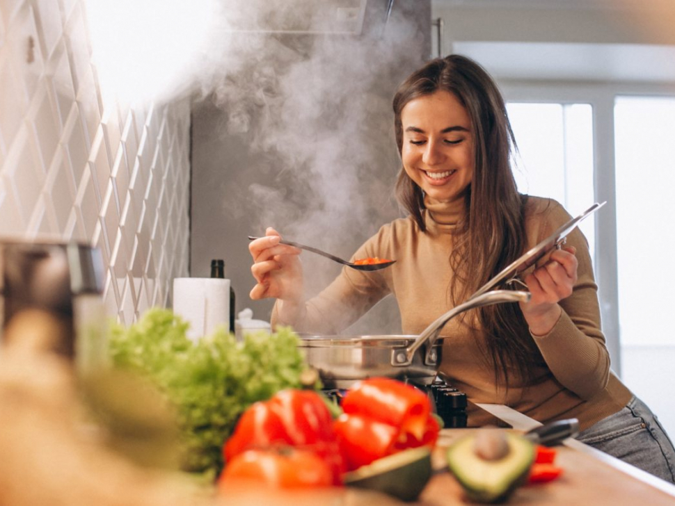Woman cooking at kitchen