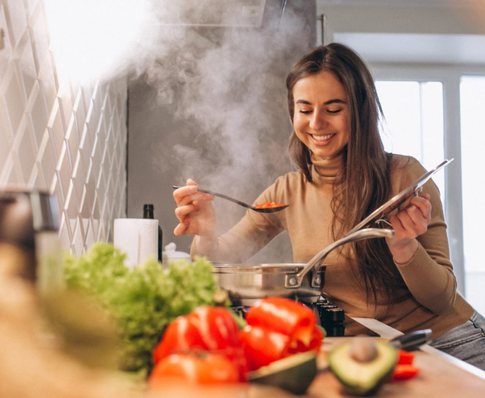 Woman cooking at kitchen